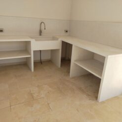 Cucina da Esterno Angolare in Cemento con Lavello e Ripiani